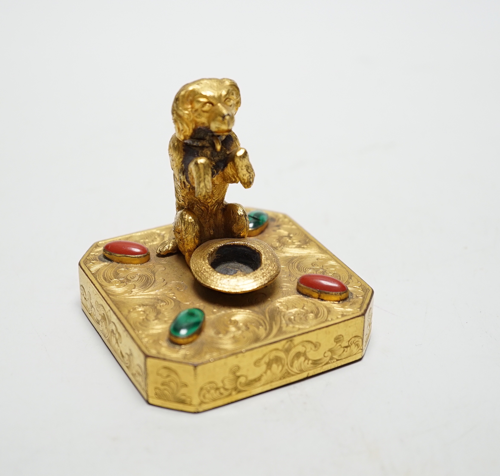 A 19th century Palais Royal ormolu ‘begging dog’ taper holder, 7cm